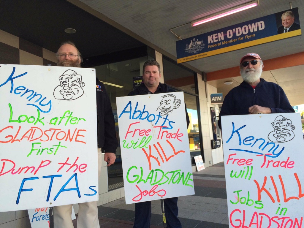 AMWU organiser Phil Golby, ETU Central Queensland organiser Craig Giddins and AMWU member Mick Jess protest the China free trade agreement outside the Gladstone office of Federal Member for Flynn Ken O'Dowd. AMWU organiser Phil Golby, ETU Central Queensland organiser Craig Giddins and AMWU member Mick Jess protest the China free trade agreement outside the Gladstone office of Federal Member for Flynn Ken O'Dowd.