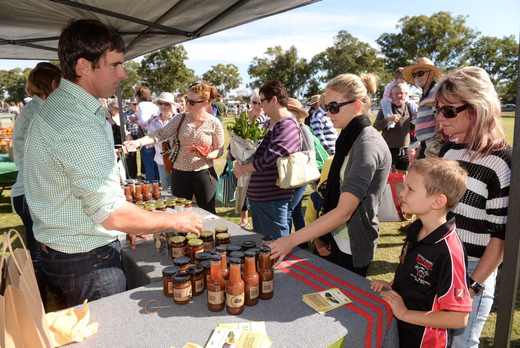 Image for sale: FIG DESSERT: Sara Rogers, Matt Rogers and Sue Wilkens talk to Will Randall from Lava Valley Produce at The Flats Farmers Market. Photo: Mike Knott / NewsMail