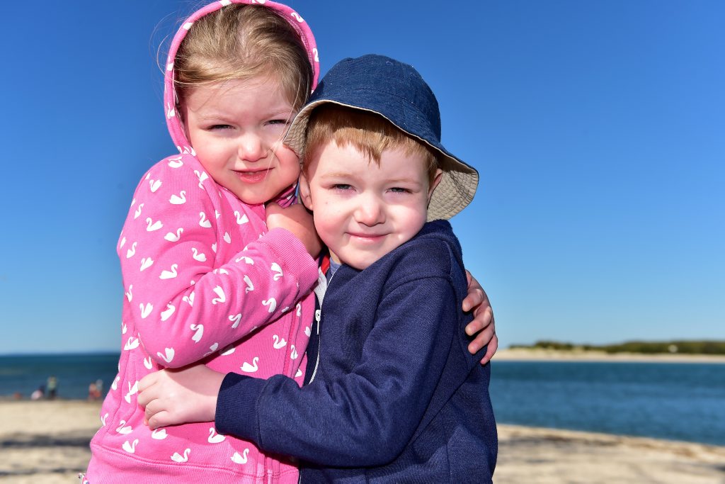 The Sunshine Coast is bracing for a cold snap. Five-year-old Twins Amber and Taylor Whittingham, of Brisbane, felt the cold at Bulcock Beach. Photo: Che Chapman / Sunshine Coast Daily