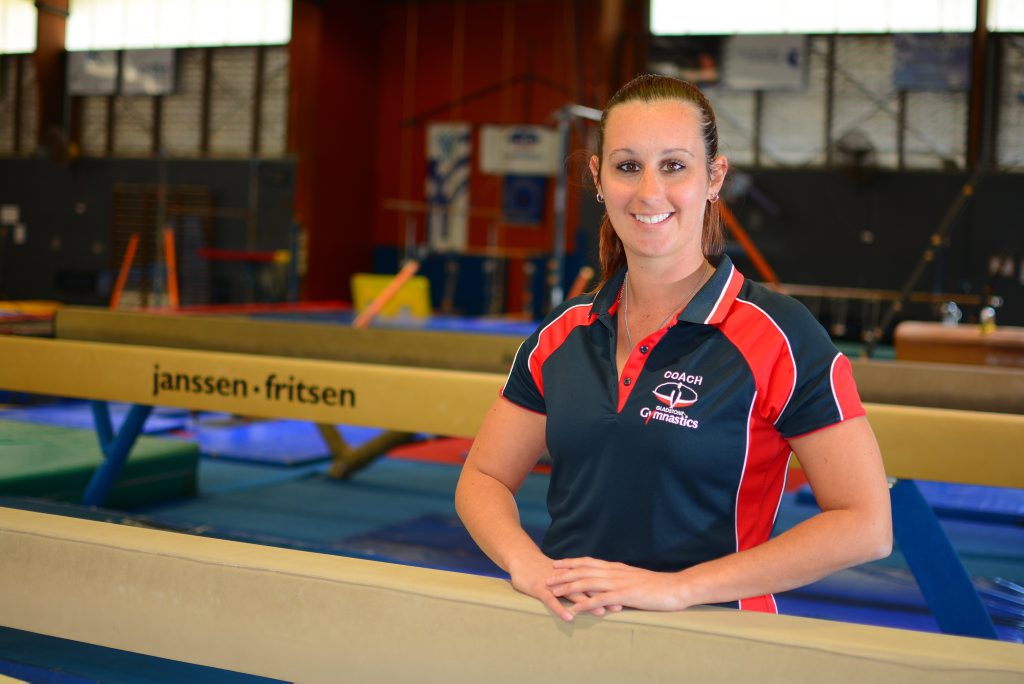 Sarah Warburton coaches at the Gladstone Gymnastics Club, a role which has helped her achieve her dream of being a teacher and coach. Photo Jake Jones / The Observer Sarah Warburton coaches at the Gladstone Gymnastics Club, a role which has helped her achieve her dream of being a teacher and coach. Photo Jake Jones / The Observer