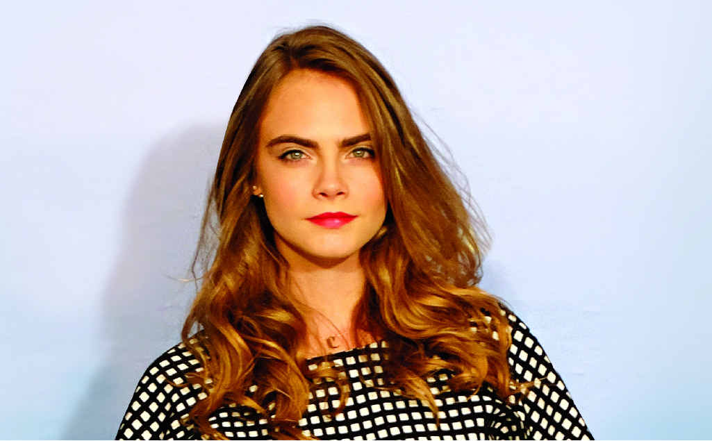 Actor Cara Delevingne pictured in Madrid for the movie Paper Towns. RIGHT: Delevingne and Nat Wolff in a scene from the movie Paper Towns. Actor Cara Delevingne pictured in Madrid for the movie Paper Towns. RIGHT: Delevingne and Nat Wolff in a scene from the movie Paper Towns.