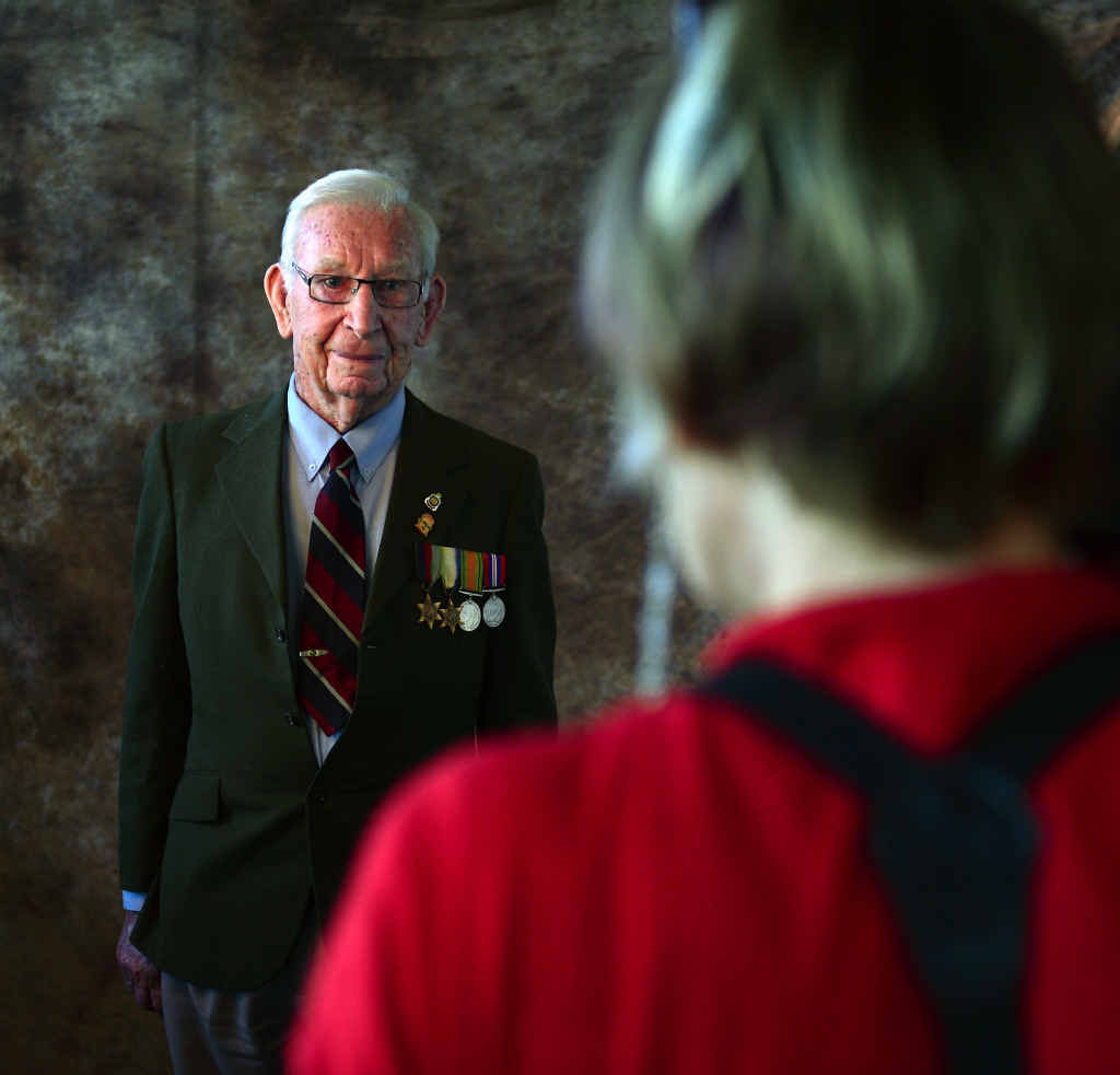 CAPTURING HISTORY: Photographer Robyn Hill takes a portrait of Second World War veteran John Chambers at the Caloundra RSL yesterday.