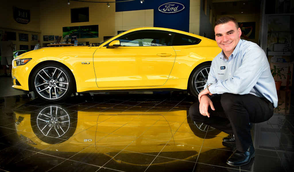 Pacific Ford senior sales consultant Alistair Eiseman with the new Mustang. Pacific Ford senior sales consultant Alistair Eiseman with the new Mustang.