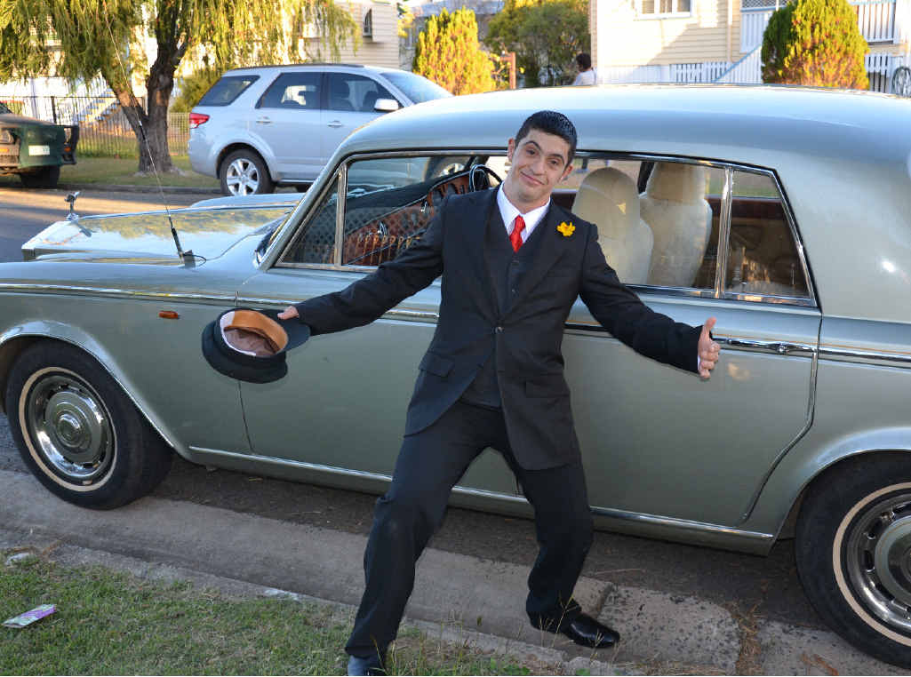 Rickki Gambin with one of the vintage cars supplied by the Rockhampton Vintage Car Club.