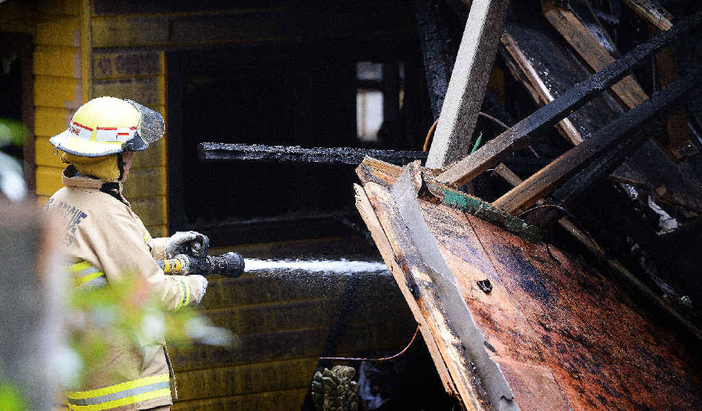 RUINED: Firefighters were still on duty yesterday mopping up a Byron Bay Queenslander style home which was destroyed by fire. RUINED: Firefighters were still on duty yesterday mopping up a Byron Bay Queenslander style home which was destroyed by fire.