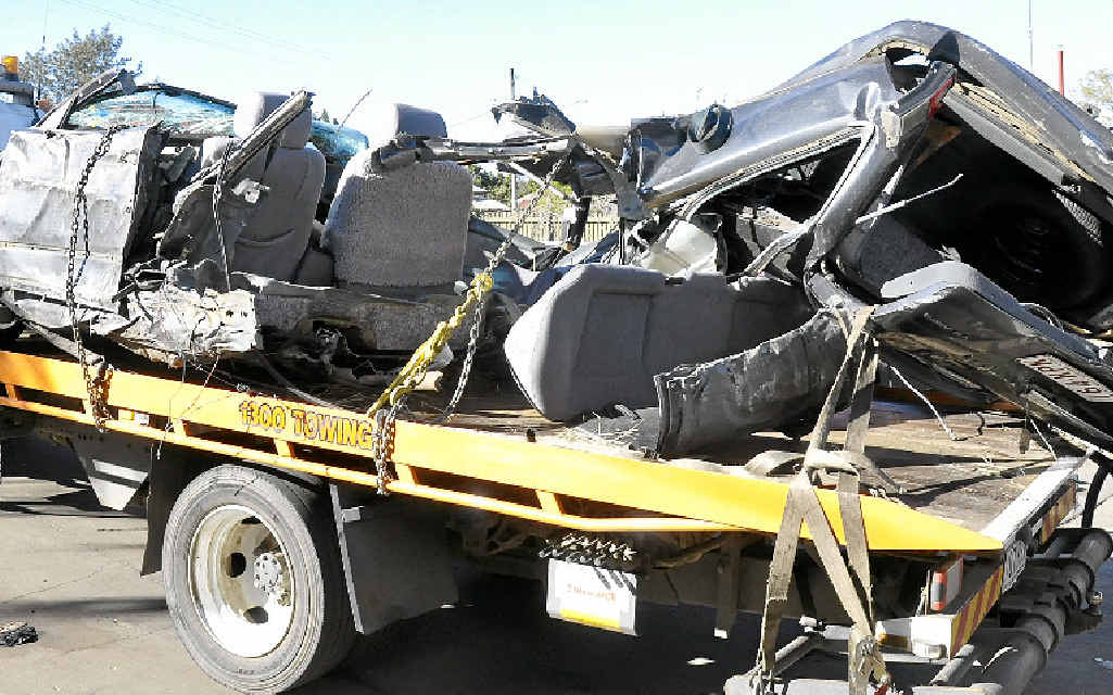 WRECKAGE: The remains of a motor vehicle left extensively damaged after a two-vehicle crash on the New England Hwy near Greenmount is moved from the scene. WRECKAGE: The remains of a motor vehicle left extensively damaged after a two-vehicle crash on the New England Hwy near Greenmount is moved from the scene.