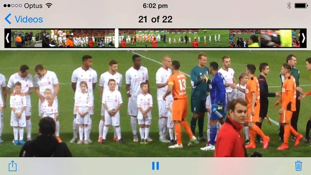 Hayden Glaske standing in front of his Liverpool heroes.