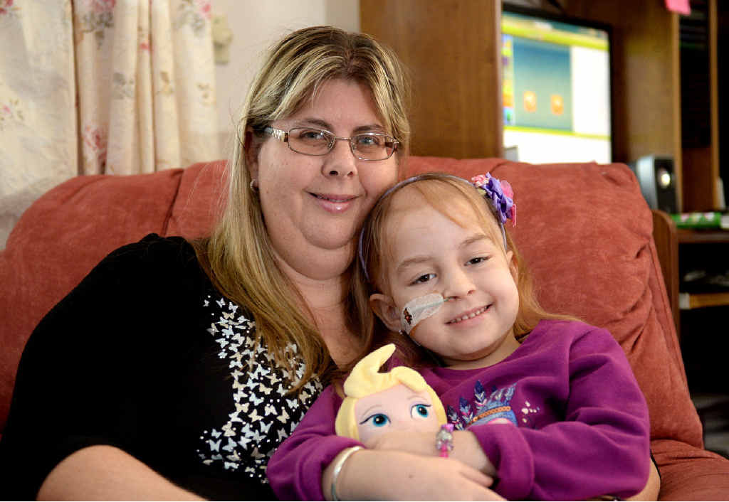 A MOTHER’S LOVE: Miami-Lee Mauger produces a rare smile as her mother Katrina holds her close. A MOTHER’S LOVE: Miami-Lee Mauger produces a rare smile as her mother Katrina holds her close.