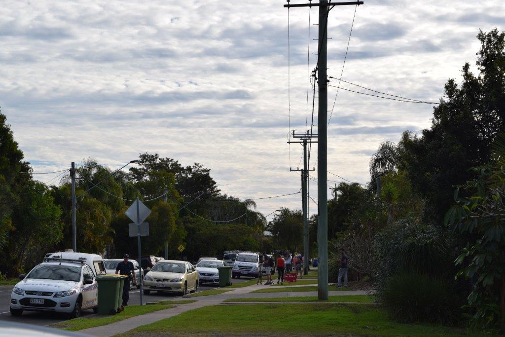 Neighbours gather around after an alleged drive-by shooting at Hilton Terrace at Noosaville. Neighbours gather around after an alleged drive-by shooting at Hilton Terrace at Noosaville.