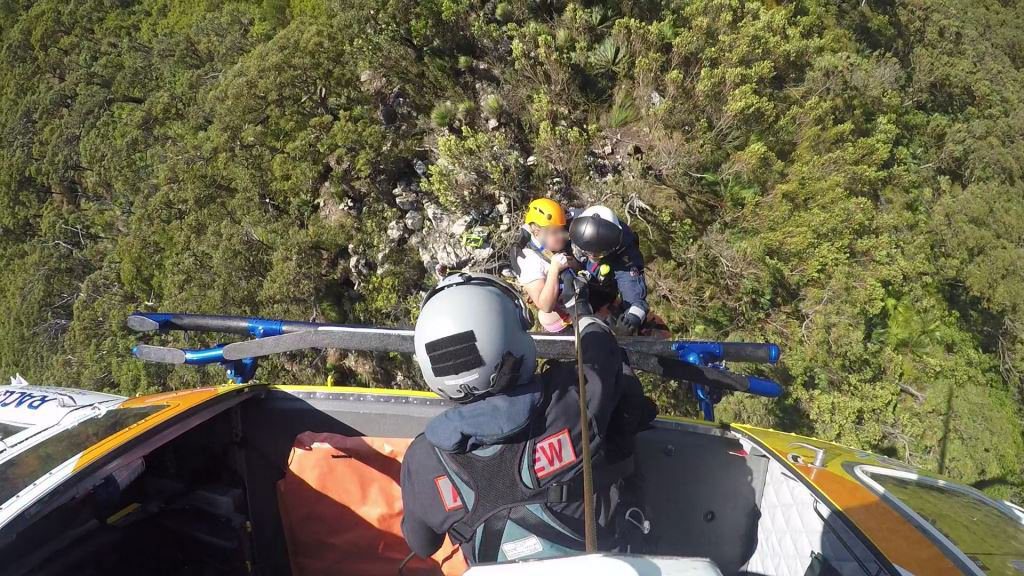 RACQ Capricorn Helicopter Rescue Service winch an Intensive Care Paramedic and Rescue Crewman to the scene of a bushwalking accident on the peak of Mount Larcom Photo: Contributed RACQ Capricorn Helicopter Rescue Service winch an Intensive Care Paramedic and Rescue Crewman to the scene of a bushwalking accident on the peak of Mount Larcom Photo: Contributed