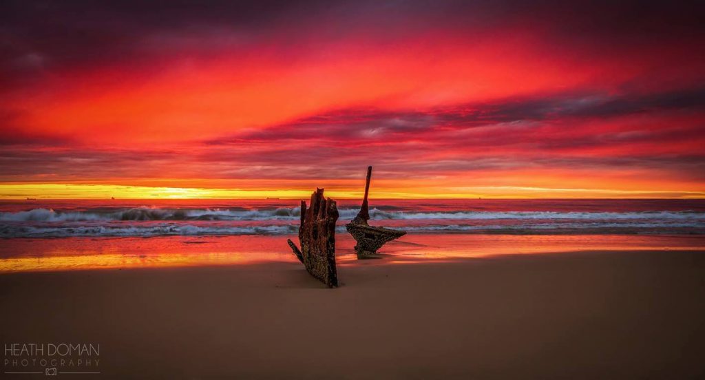 WINNING PHOTO: Heath Doman SS Dicky wreck, sunrise on Saturday morning's stunning display of colour. Three more sunrises before it is removed from its home of the past 122 years. 