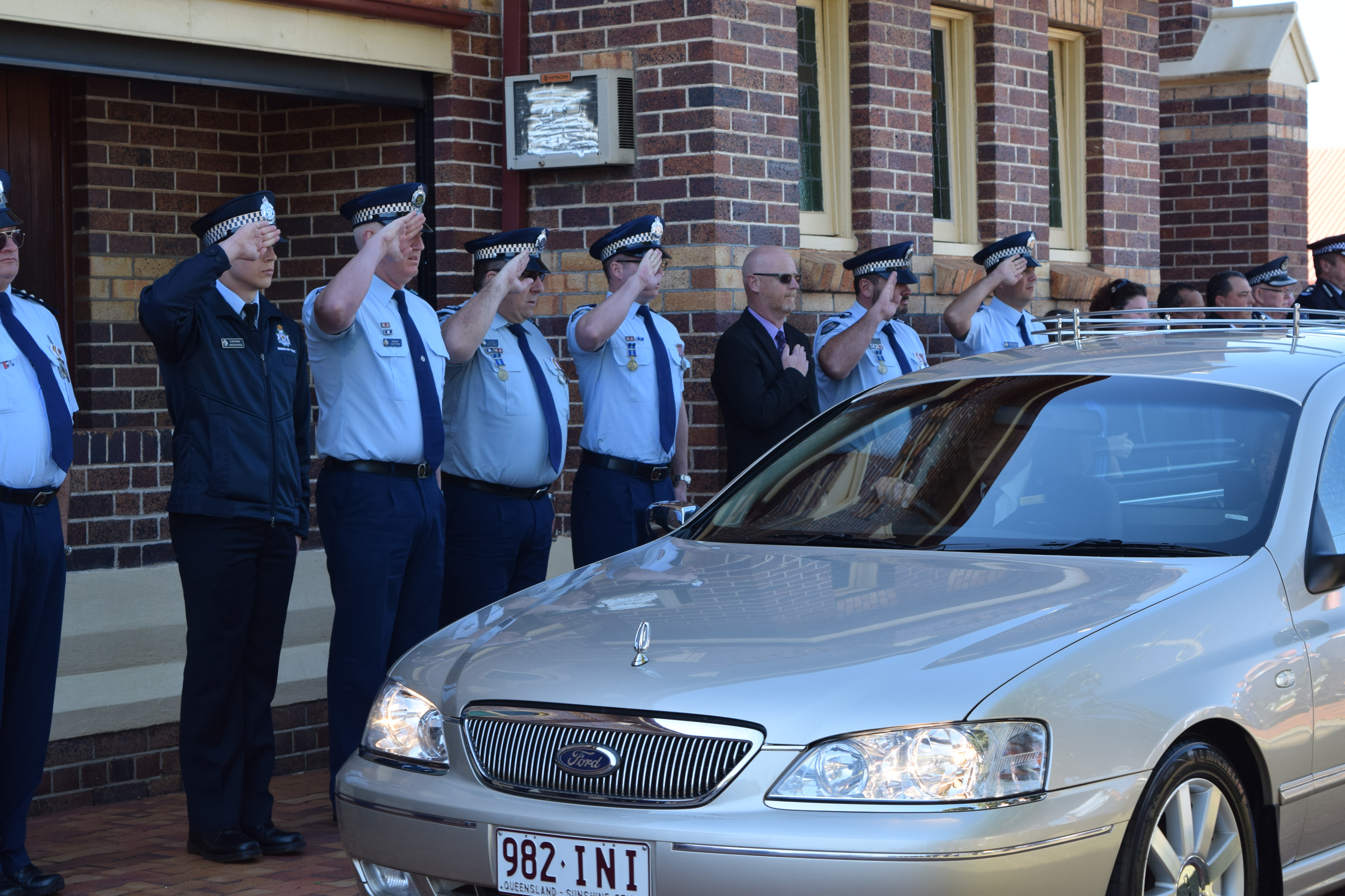 GUARD OF HONOUR: Police officers lined the path to form a guard of honour to Michael O'Halloran who served at the Dalby station for 14 years. GUARD OF HONOUR: Police officers lined the path to form a guard of honour to Michael O'Halloran who served at the Dalby station for 14 years.