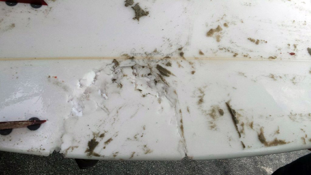 Surfboard belonging to a surfer who was bitten by a shark on his legs and hands at Evans Head. Surfboard belonging to a surfer who was bitten by a shark on his legs and hands at Evans Head.