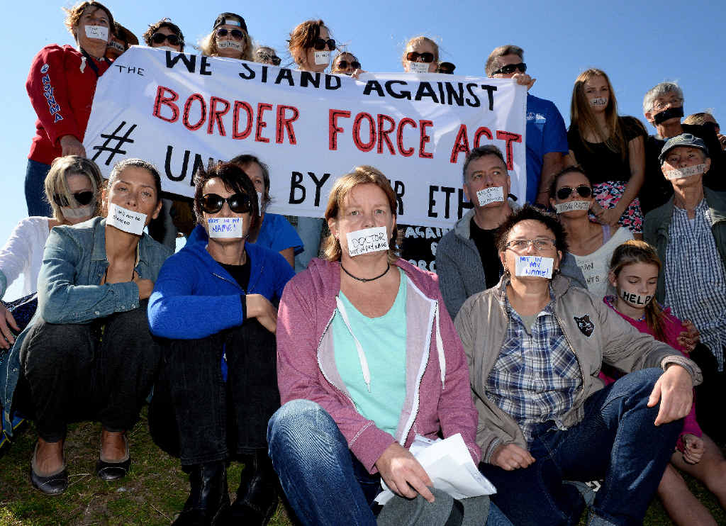 GAG SYMBOLIC: Doctors, nurses, health care workers and teachers from the Northern Rivers protest against the Border Force Act, in Byron Bay. GAG SYMBOLIC: Doctors, nurses, health care workers and teachers from the Northern Rivers protest against the Border Force Act, in Byron Bay.