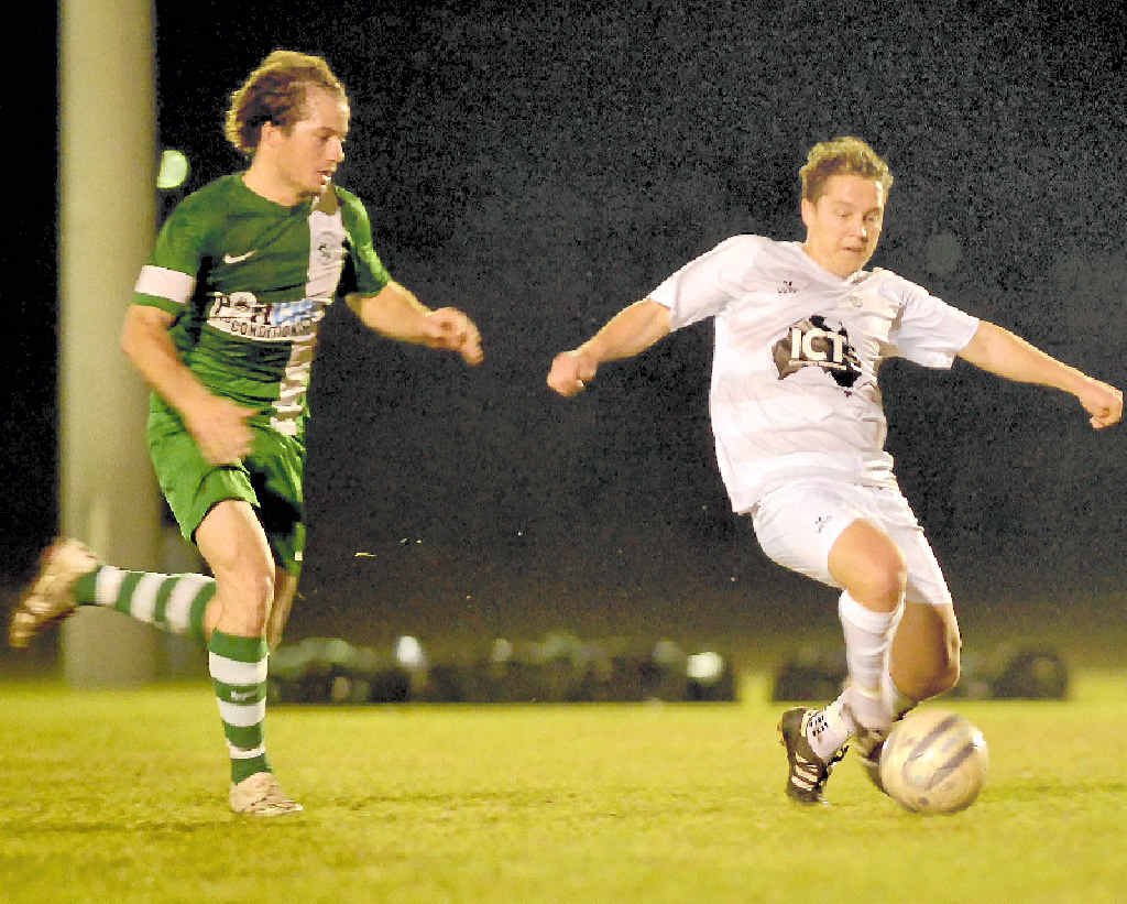 Clinton’s Mitch Innocend and Frenchville’s Daniel Trim. - CQ Premier League Soccer, Clinton v Frenchville. Photo Paul Braven / The Observer Clinton’s Mitch Innocend and Frenchville’s Daniel Trim. - CQ Premier League Soccer, Clinton v Frenchville. Photo Paul Braven / The Observer