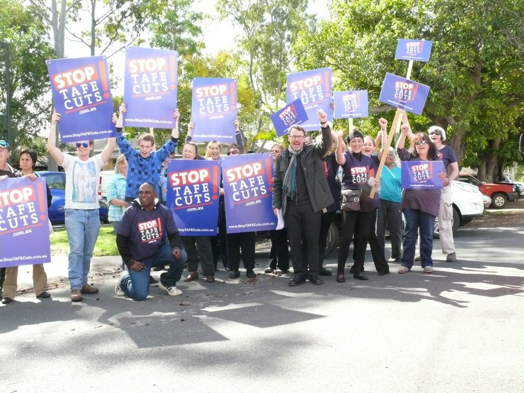 Greens senator Dr John Kaye leads Grafton TAFE protesters at a rally in the city last August. Greens senator Dr John Kaye leads Grafton TAFE protesters at a rally in the city last August.