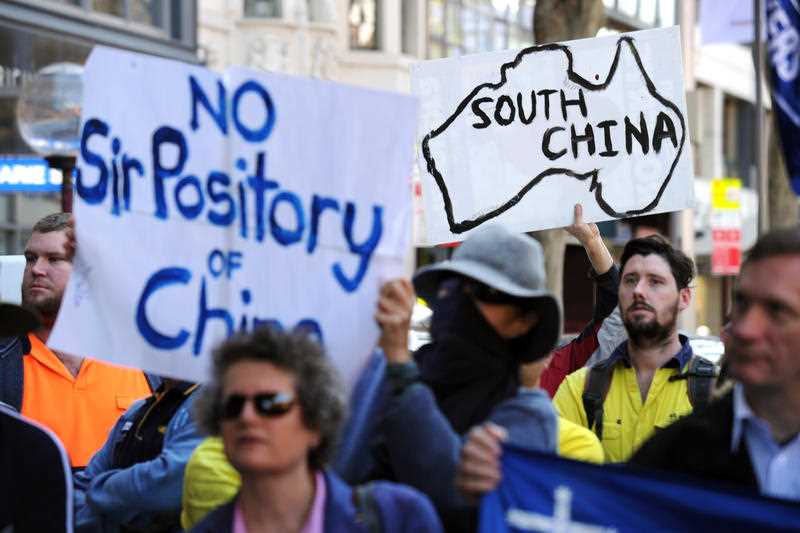 Union members rally against the China-Australia Free Trade Agreement outside NSW Parliament in Sydney, Friday, July 31, 2015. Union members rally against the China-Australia Free Trade Agreement outside NSW Parliament in Sydney, Friday, July 31, 2015.