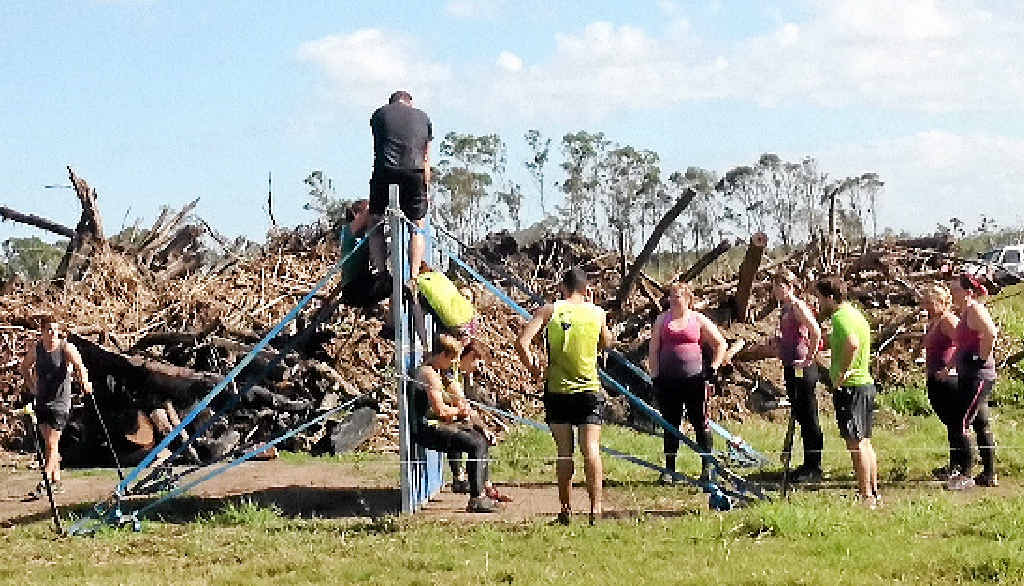UP AND OVER: Participants face one of the challenges in the Obstacles Gone Mad event at Yeppoon on Saturday. UP AND OVER: Participants face one of the challenges in the Obstacles Gone Mad event at Yeppoon on Saturday.