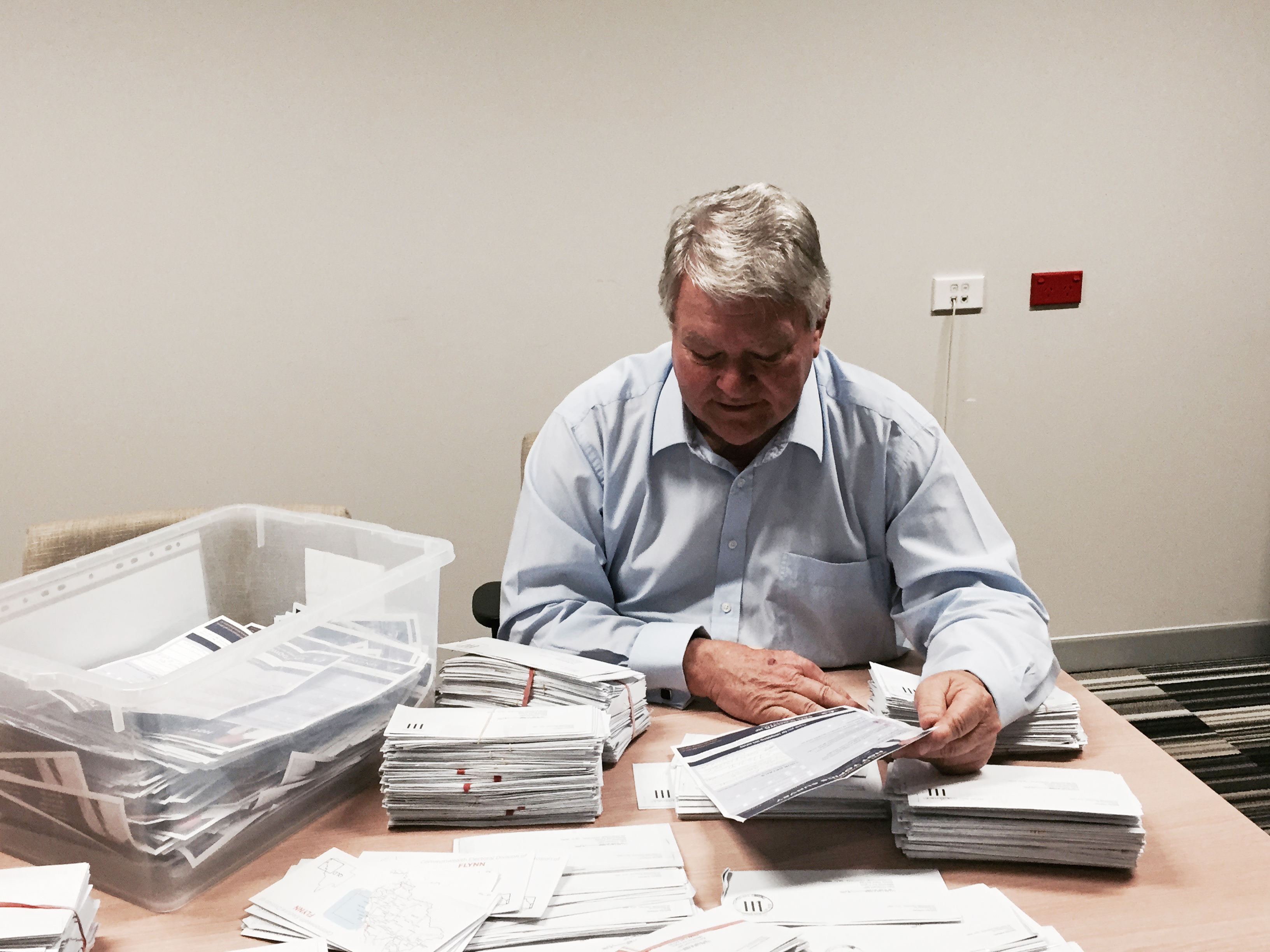Member for Flynn Ken O'Dowd looks over survey submissions. 