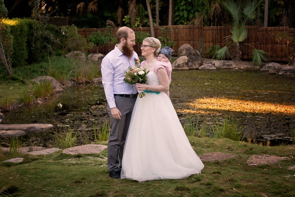 Sam and Jennifer Brown were married at the Japanese Tea Gardens at the Toondoon Botanic Garden with Braxton on Jennifer's back. Sam and Jennifer Brown were married at the Japanese Tea Gardens at the Toondoon Botanic Garden with Braxton on Jennifer's back.