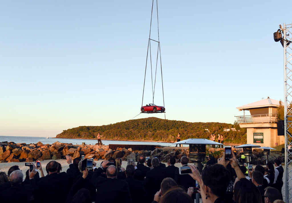 CROWD PLEASER: A helicopter lowered Mazda’s new MX-5 roadster model onto Noosa’s Main Beach yesterday as part of the Japanese car brand’s #lookup campaign. CROWD PLEASER: A helicopter lowered Mazda’s new MX-5 roadster model onto Noosa’s Main Beach yesterday as part of the Japanese car brand’s #lookup campaign.