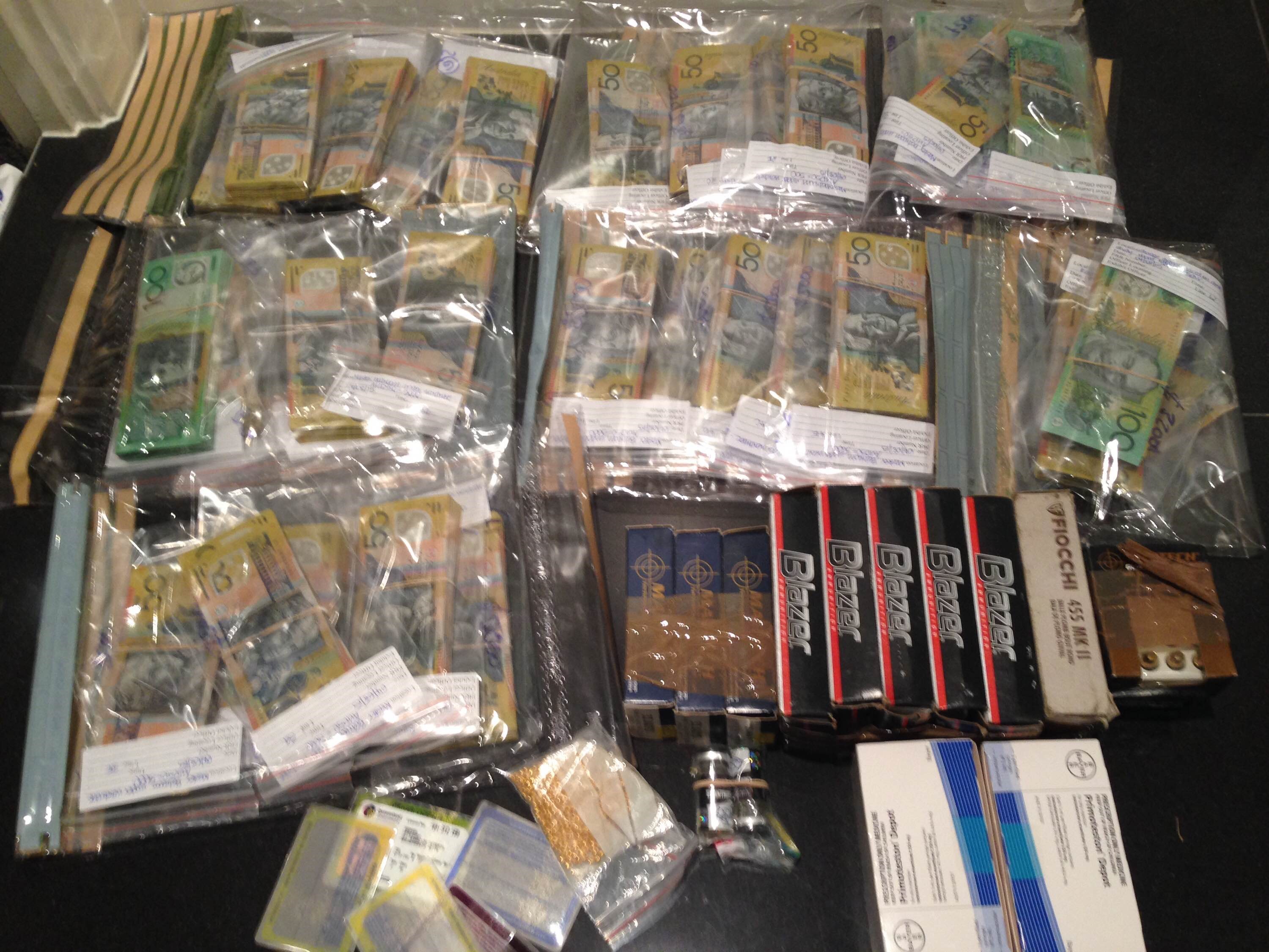 A sample of the drugs, fake licences and cash seized from a Gold Coast raid A sample of the drugs, fake licences and cash seized from a Gold Coast raid
