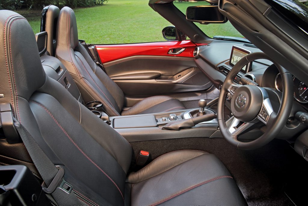 SIMPLE: Unfussy cabin features thin steering wheel and tiny short-shift gear stick to add to the involving drive experience. SIMPLE: Unfussy cabin features thin steering wheel and tiny short-shift gear stick to add to the involving drive experience.