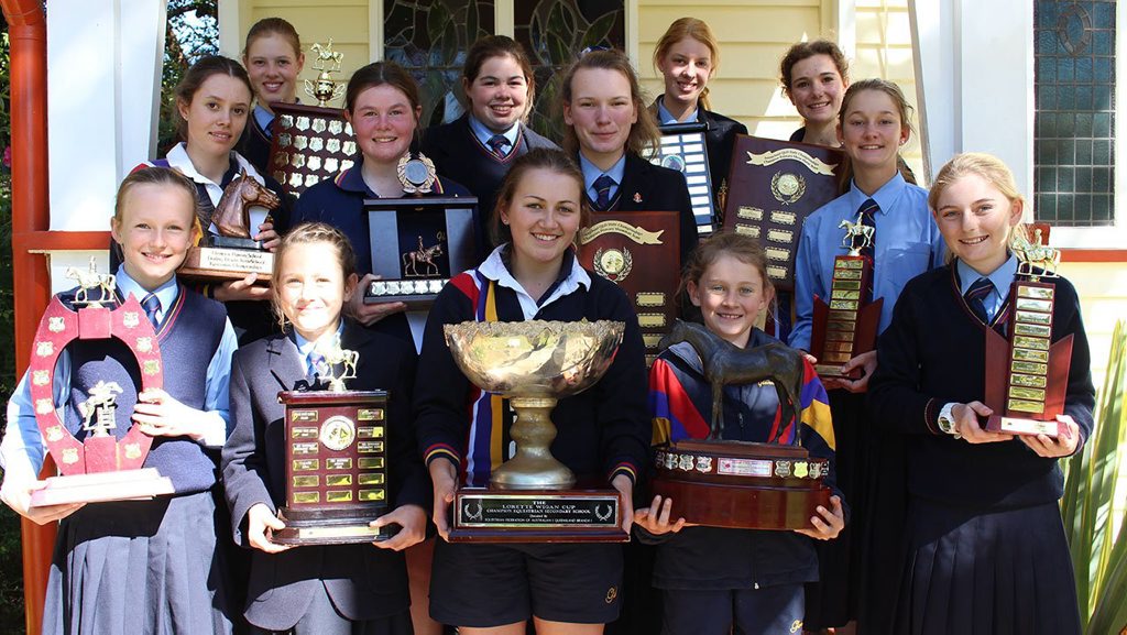 Glennie equestrian team members proudly hold their 2015 trophy collection. 