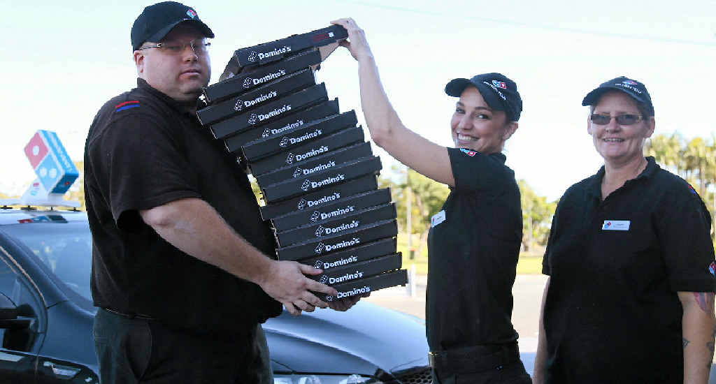 STACKS OF EXPERIENCE: Delivery driver Phil Twiner, franchisee Jennifer Dooley and delivery driver Karen Ricks were celebrating big milestones at Domino’s Bridge St store yesterday STACKS OF EXPERIENCE: Delivery driver Phil Twiner, franchisee Jennifer Dooley and delivery driver Karen Ricks were celebrating big milestones at Domino’s Bridge St store yesterday