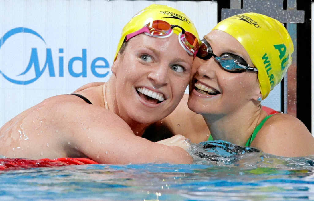 GOLDEN SMILE: Emily Seebohm (left) celebrates winning the gold medal with silver medallist Madison Wilson in the women’s 100m backstroke final at the world titles in Russia. GOLDEN SMILE: Emily Seebohm (left) celebrates winning the gold medal with silver medallist Madison Wilson in the women’s 100m backstroke final at the world titles in Russia.