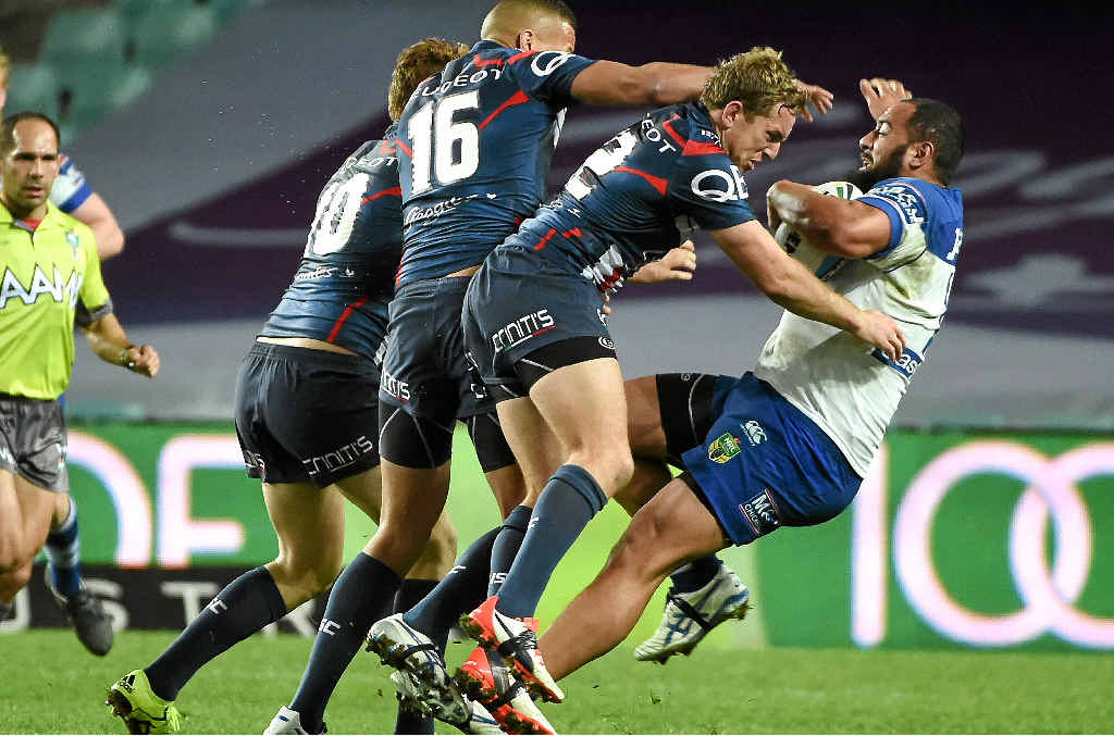 BOWLED OVER: Bulldogs forward Sam Kasiano (right) is shoulder-charged in the match against the Sydney Roosters last Friday. BOWLED OVER: Bulldogs forward Sam Kasiano (right) is shoulder-charged in the match against the Sydney Roosters last Friday.