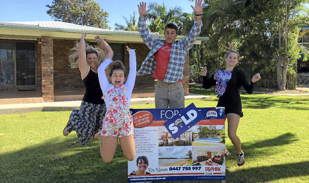 TOP SPOT: Kelly, Bodhi, Don and Korby Caldwell celebrate buying their new home at Boyne Island. TOP SPOT: Kelly, Bodhi, Don and Korby Caldwell celebrate buying their new home at Boyne Island.