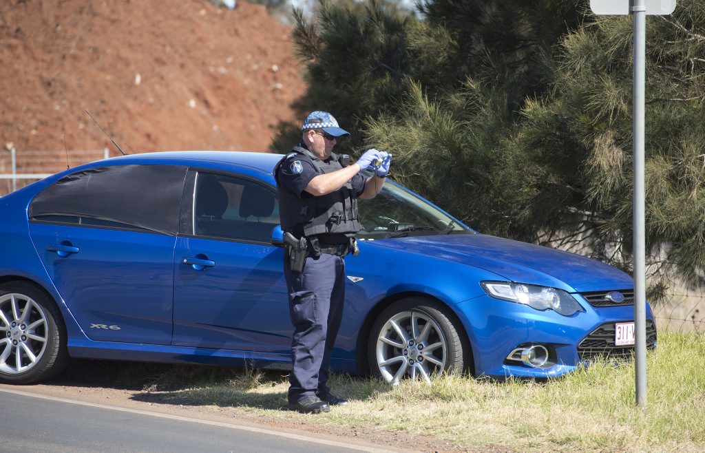 Gunman on the run in Glenvale area after crashing a vehicle at South and McDougall Streets. Thursday, Aug 13, 2015 . Photo Nev Madsen / The Chronicle Gunman on the run in Glenvale area after crashing a vehicle at South and McDougall Streets. Thursday, Aug 13, 2015 . Photo Nev Madsen / The Chronicle