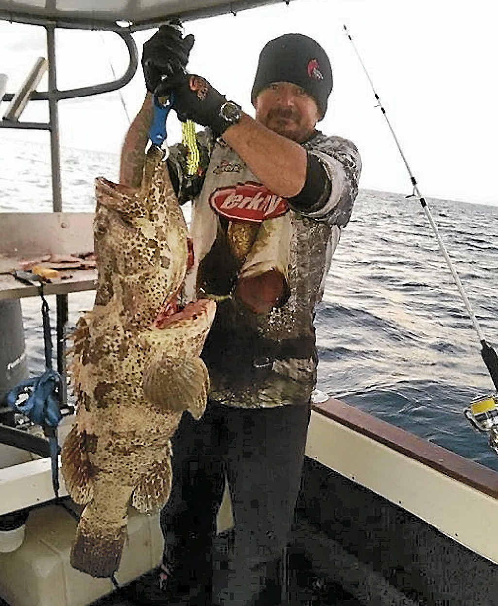 Clint Hopkins with a 99cm flower cod. Clint Hopkins with a 99cm flower cod.