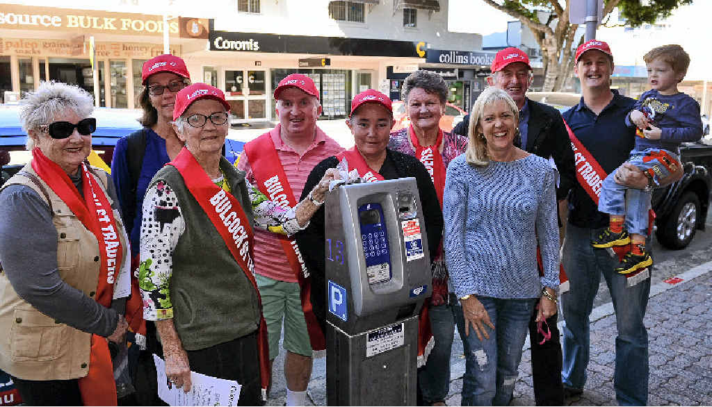 STOPPING FINES: Caloundra’s “meter mates” rub shoulders with Bulcock Street Traders spokeswoman Selina Smith, the one without the sash. STOPPING FINES: Caloundra’s “meter mates” rub shoulders with Bulcock Street Traders spokeswoman Selina Smith, the one without the sash.