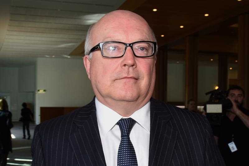 Attorney-General George Brandis speaks to the media during a doorstop interview at Parliament House in Canberra, Thursday, Aug. 13, 2015. Labor is accusing the Government of a Attorney-General George Brandis speaks to the media during a doorstop interview at Parliament House in Canberra, Thursday, Aug. 13, 2015. Labor is accusing the Government of a