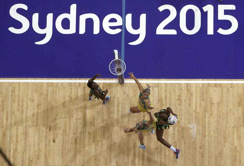 Australia's Julie Corletto, top right, and Laura Geitz bottom left, battle with Jamaica's Shanice Beckford left, and Romelda Aiken, right, during their Netball World Cup semi final in Sydney, Australia, Saturday, Aug. 15, 2015. Australia's Julie Corletto, top right, and Laura Geitz bottom left, battle with Jamaica's Shanice Beckford left, and Romelda Aiken, right, during their Netball World Cup semi final in Sydney, Australia, Saturday, Aug. 15, 2015.