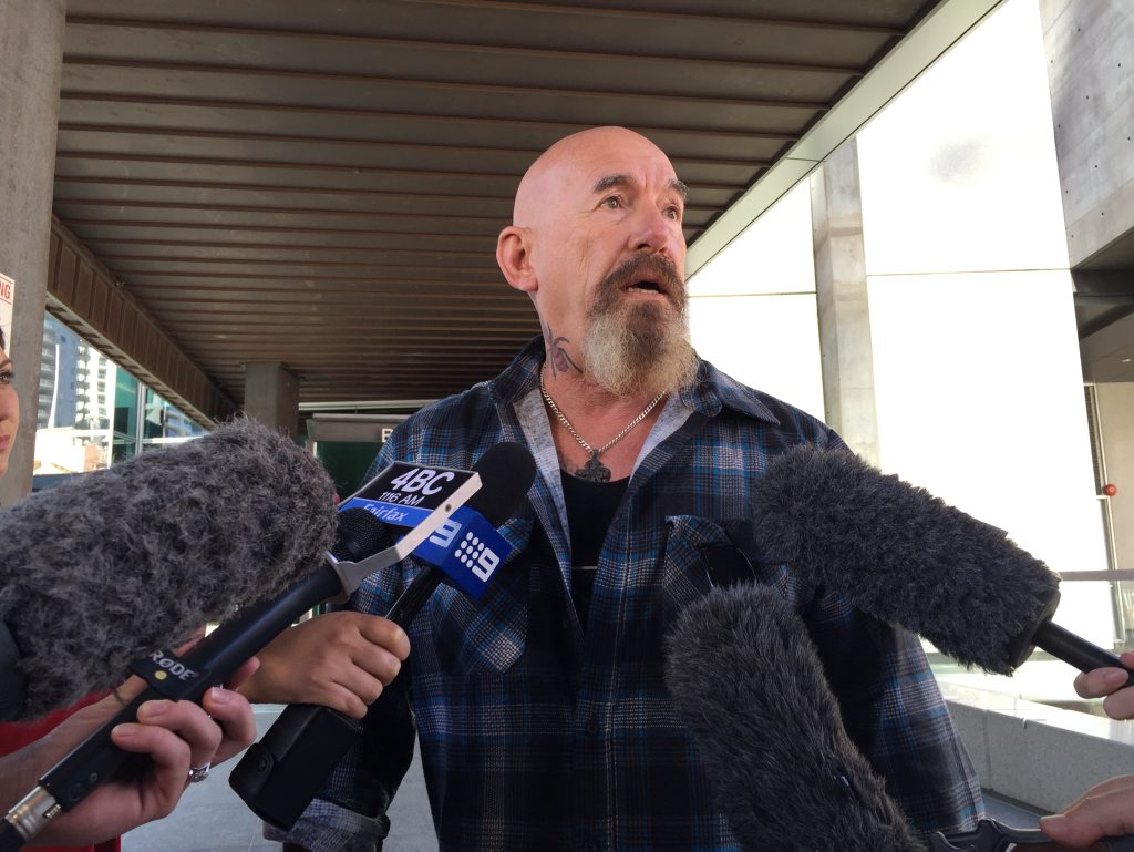 Army veteran and motorcycle gang member Ronald Germain speaks to the media outside the Brisbane Magistrates Court, Brisbane, Wednesday, April 8, 2015. Germain, fellow gang member Phillip Palmer and Palmer's partner Sally Kuether avoided jail terms for breaching Queensland's anti-association laws by meeting at a pub. They instead received minor fines after police dropped some of the charges. (AAP Image/Miranda Forster) Army veteran and motorcycle gang member Ronald Germain speaks to the media outside the Brisbane Magistrates Court, Brisbane, Wednesday, April 8, 2015. Germain, fellow gang member Phillip Palmer and Palmer's partner Sally Kuether avoided jail terms for breaching Queensland's anti-association laws by meeting at a pub. They instead received minor fines after police dropped some of the charges. (AAP Image/Miranda Forster)