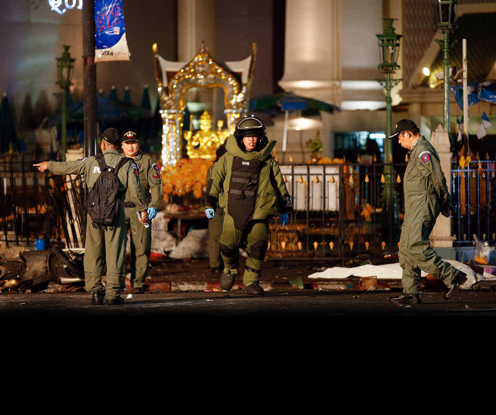 A member of the bob squad in protective suit walks next to the body of a victim after an explosion near Erawan Shrine, central Bangkok, Thailand, 17 August 2015. An explosion in a busy commercial district in the Thai capital killed a yet unconfirmed number of people. Witnesses said the explosion happened around 7:15 pm (1215 GMT) at the Rajprasong Intersection, a business area famous among tourists and locals for a revered Hindu shrine. A member of the bob squad in protective suit walks next to the body of a victim after an explosion near Erawan Shrine, central Bangkok, Thailand, 17 August 2015. An explosion in a busy commercial district in the Thai capital killed a yet unconfirmed number of people. Witnesses said the explosion happened around 7:15 pm (1215 GMT) at the Rajprasong Intersection, a business area famous among tourists and locals for a revered Hindu shrine.