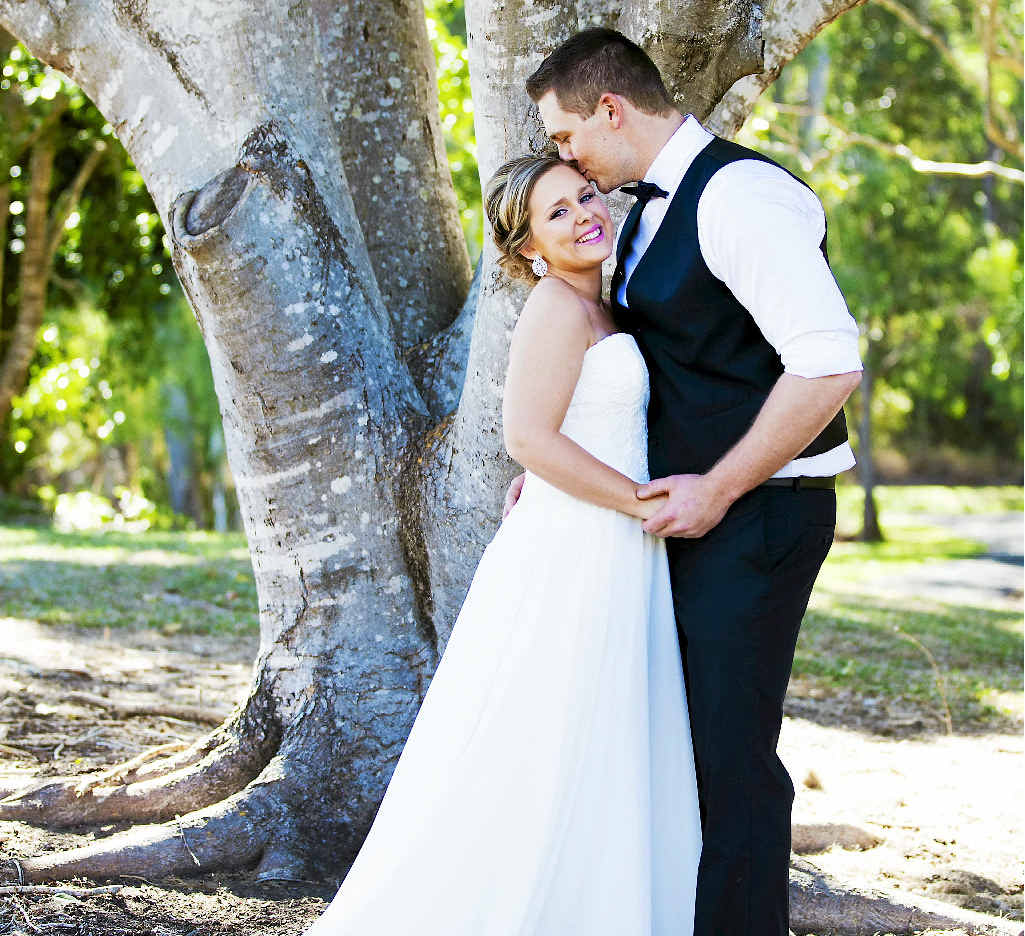 FAMILY SURPRISE: Sam and Matt Merritt photographed at Tondoon Botanic Gardens by Kirtsen Cunningham before their surprise wedding. FAMILY SURPRISE: Sam and Matt Merritt photographed at Tondoon Botanic Gardens by Kirtsen Cunningham before their surprise wedding.