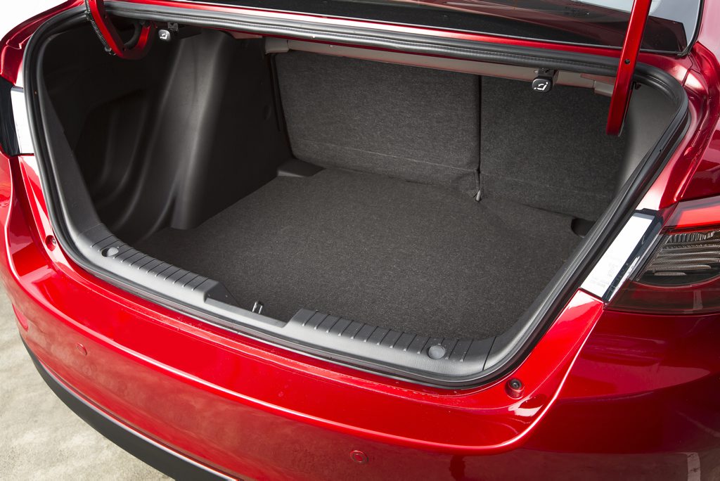 BOOTED: Mazda2 Sedan offers 440-litres of cargo space to the Hatch version's 250. It is still trailing in the Honda City's 536-litre wake however. BOOTED: Mazda2 Sedan offers 440-litres of cargo space to the Hatch version's 250. It is still trailing in the Honda City's 536-litre wake however.