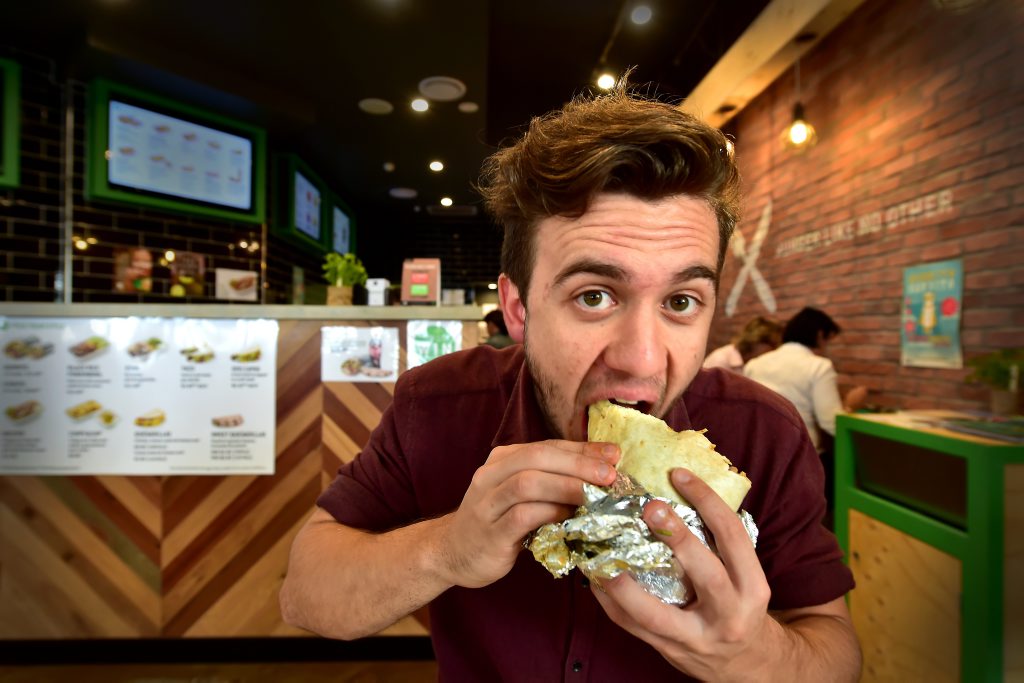Zambrero has restaurants across Queensland, including this one at Mooloolaba, where Luke Simmonds is tucking into a burrito. Zambrero has restaurants across Queensland, including this one at Mooloolaba, where Luke Simmonds is tucking into a burrito.