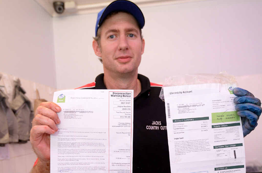 BILL SHOCK: Greig Jamieson, owner of Jack’s Country Cuts, with the bills sent from Ergon that total more than $14,000. BILL SHOCK: Greig Jamieson, owner of Jack’s Country Cuts, with the bills sent from Ergon that total more than $14,000.