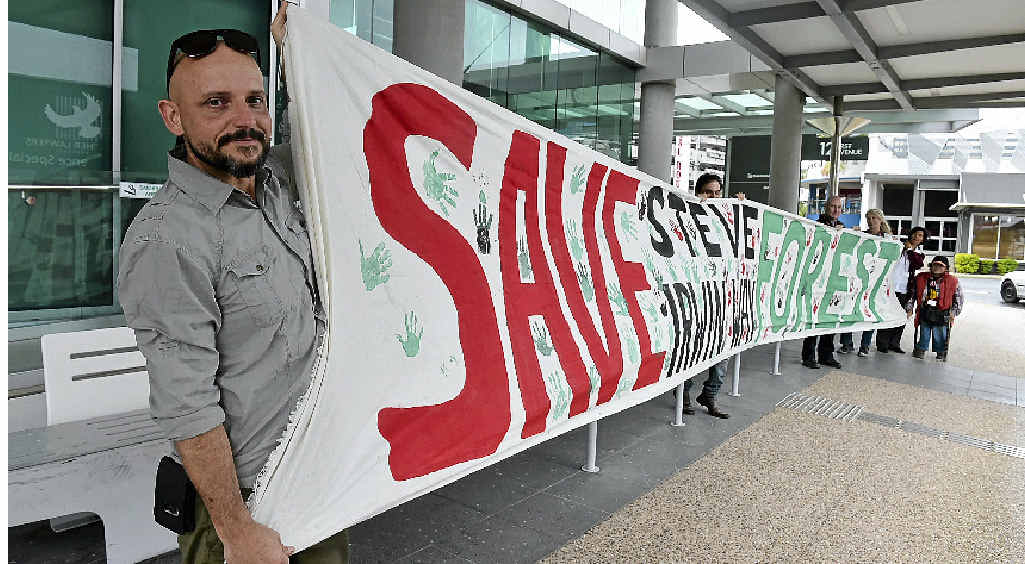 PROTEST: Wayne Reid (left) holds a banner outside the Department of Transport and Main Roads office in Maroochydore during a protest against planning for the Caloundra Rd-Bruce Hwy interchange. PROTEST: Wayne Reid (left) holds a banner outside the Department of Transport and Main Roads office in Maroochydore during a protest against planning for the Caloundra Rd-Bruce Hwy interchange.