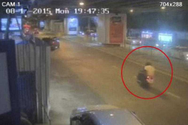 This Aug. 17, 2015, annotated image, released by Royal Thai Police spokesman Lt. Gen. Prawut Thavornsiri shows a man wearing a yellow T-shirt riding on the back of a motorcycle near the Erawan Shrine in Bangkok, Thailand. Prawut said he believes a man in a yellow T-shirt caused the blast that killed a number of people at a shrine in downtown Bangkok on Monday night. This Aug. 17, 2015, annotated image, released by Royal Thai Police spokesman Lt. Gen. Prawut Thavornsiri shows a man wearing a yellow T-shirt riding on the back of a motorcycle near the Erawan Shrine in Bangkok, Thailand. Prawut said he believes a man in a yellow T-shirt caused the blast that killed a number of people at a shrine in downtown Bangkok on Monday night.