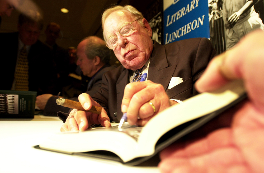 Sydney, August 13, 2001. Author Roland Perry (left) and former invincible Arthur Morris sign copies of the Roland Perry book Bradmans Best. Sydney, August 13, 2001. Author Roland Perry (left) and former invincible Arthur Morris sign copies of the Roland Perry book Bradmans Best.