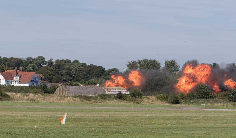 UK, Shoreham-by-Sea: Flames erupt from the site of a fatal accident, wherein a Hawker Hunter jet crashed into several vehicles and exploded, leaving at least seven dead at the Shoreham Airshow in Shoreham-by-Sea, UK on August 22, 2015. UK, Shoreham-by-Sea: Flames erupt from the site of a fatal accident, wherein a Hawker Hunter jet crashed into several vehicles and exploded, leaving at least seven dead at the Shoreham Airshow in Shoreham-by-Sea, UK on August 22, 2015.