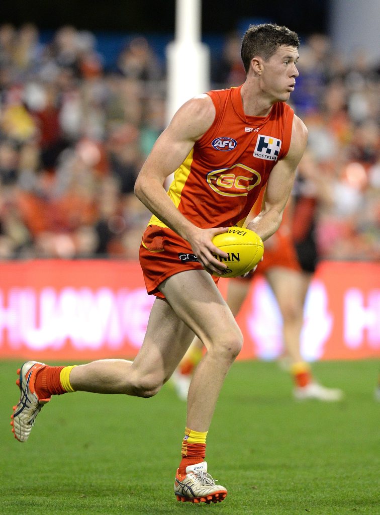GOLD COAST, AUSTRALIA - AUGUST 22: Henry Schade of the Suns in action during the round 21 AFL match between the Gold Coast Suns and the Essendon Bombers at Metricon Stadium on August 22, 2015 in Gold Coast, Australia. (Photo by Bradley Kanaris/Getty Images) GOLD COAST, AUSTRALIA - AUGUST 22: Henry Schade of the Suns in action during the round 21 AFL match between the Gold Coast Suns and the Essendon Bombers at Metricon Stadium on August 22, 2015 in Gold Coast, Australia. (Photo by Bradley Kanaris/Getty Images)