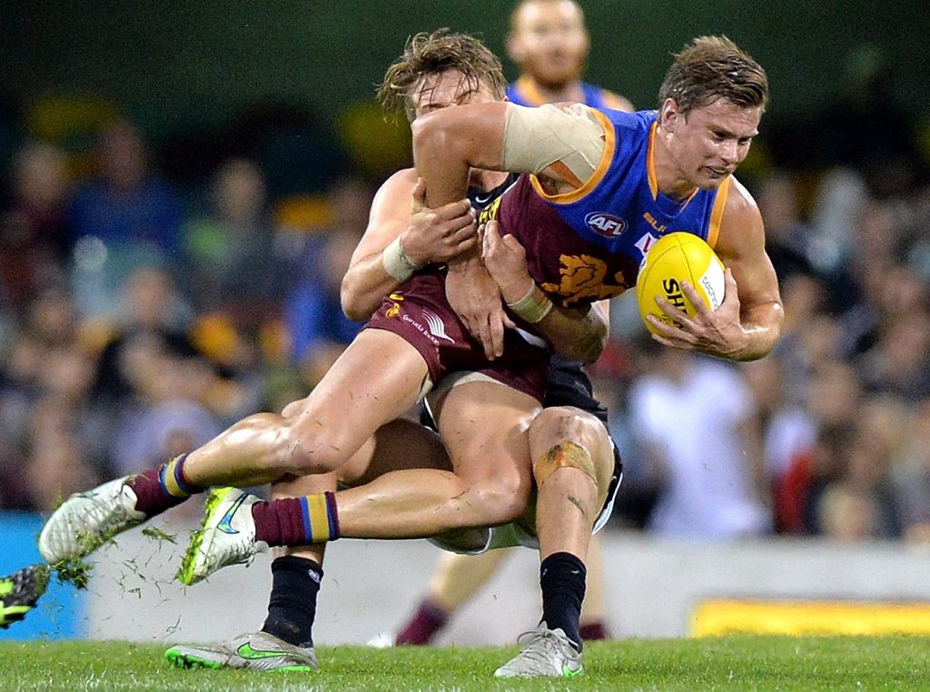 BRISBANE, QUEENSLAND - AUGUST 15: Liam Dawson of the Lions is pressured by the defence during the round 20 AFL match between the Brisbane Lions and the Carlton Blues at The Gabba on August 15, 2015 in Brisbane, Australia. (Photo by Bradley Kanaris/AFL Media/Getty Images) BRISBANE, QUEENSLAND - AUGUST 15: Liam Dawson of the Lions is pressured by the defence during the round 20 AFL match between the Brisbane Lions and the Carlton Blues at The Gabba on August 15, 2015 in Brisbane, Australia. (Photo by Bradley Kanaris/AFL Media/Getty Images)