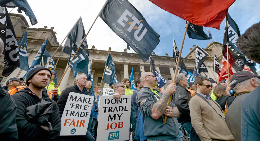 NOT FAIR ENOUGH: Union and community members rally yesterday on the steps of the Victorian Parliament in Melbourne to demand changes to the China-Australia Free Trade Agreement. NOT FAIR ENOUGH: Union and community members rally yesterday on the steps of the Victorian Parliament in Melbourne to demand changes to the China-Australia Free Trade Agreement.